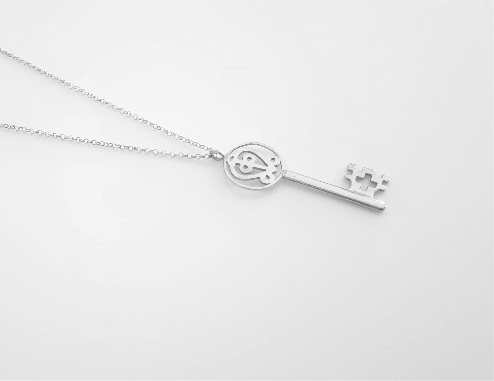 love adinkra silver pendant